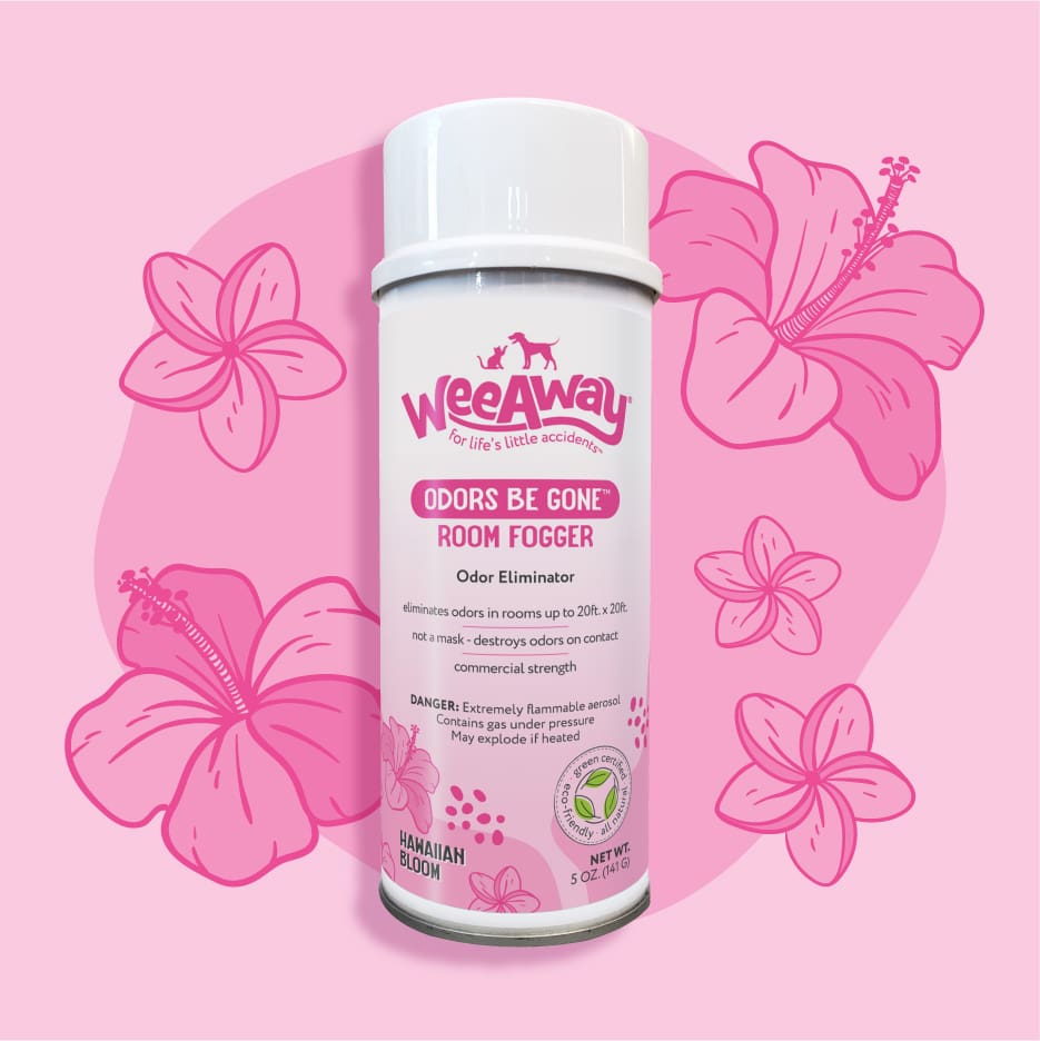white 5oz. can of Wee Away Odors Be Gone room fogger in Hawaiian Bloom scent with pink label. Pink background with hawaiin flowers.